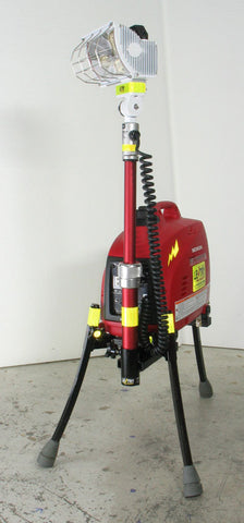 LENTRY Light System model 1OPUPS consisting of a 1000 watt generator, standard height pole, and a 750 watt light. The three independently adjustable legs and telescoping pole are fully extended with the light head aiming slighting to the side.