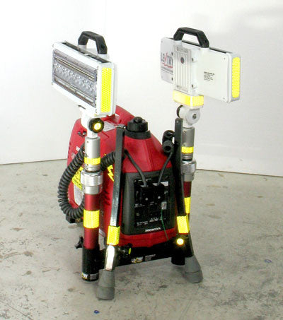 Dual LED LENTRY Light System model 1SPECSS with a 1000 watt generator and two V-Spec LEDs. Shown here with the three independently adjustable legs and telescpoing poles all fully retracted, while the light heads are facing to each side in opposite directions.
