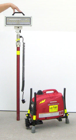 LENTRY Light Model 1SPECX with a 1000 watt generator and XT height V-Spec LED. Shown here, the all-terrain legs are fully retracted protecting the generator, while the retracted XT height pole is propped up next to it.