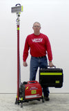 Even when fully retracted, Lentry LED Lighting System Model 2SPECH-C23 stands taller than the 6-foot man standing next to the system. A Case in included to store the LED light head.