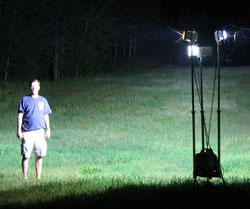 All-Terrain Lentry Ligthing System Model 2SPECXX shown outside fully extended at 9-feet tall (6-foot man also shown).