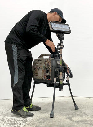 Portable Camo Lentry Light Model 2SPECX+S-C23-CMO with standard height pole installed next to 6-foot man. Not shown: XT height pole and Case.