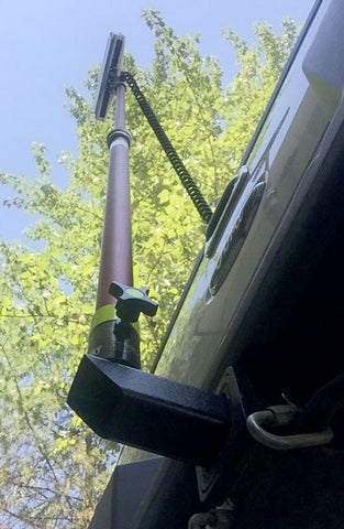 View from underneath Lentry Lighting System's Receiver Hitch Pole Mount, shown with an extra tall LED and attached to a truck's trailor hitch