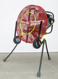All-Terrain VENTRY 24-inch Fan Model 24GX120 with optional Medium Flat-Free Wheels & Skids and Misting Ring Kit. The three independently adjustable legs are fully extended, with the exception of the rear leg, which is slightly retracted, allowing the fan to be aimed at an upward angle.