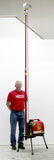 Ken (6' tall) stands next to Lentry Halogen Light Tower Model 2OPUPH, which when fully extended, stands at 13 ft tall.